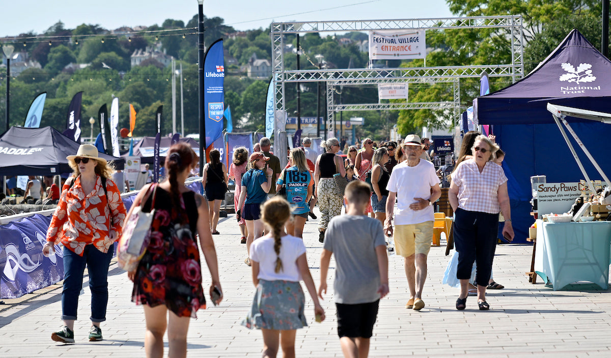 Visitors exploring the festival village at the English Riviera SUP World Cup
